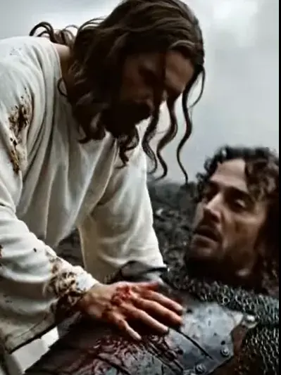 ✨ Jesus’ hand glows brightly, healing the soldier’s wounds in an instant. He stands in disbelief as Jesus smiles and walks away—the battlefield blooms with green grass and flowers.